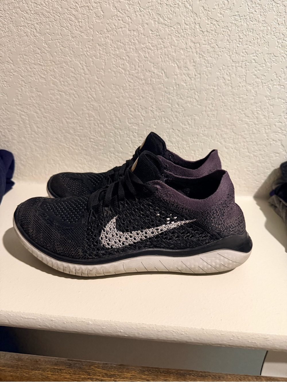 Nike Women's Black and White Flyknit Running Sneakers